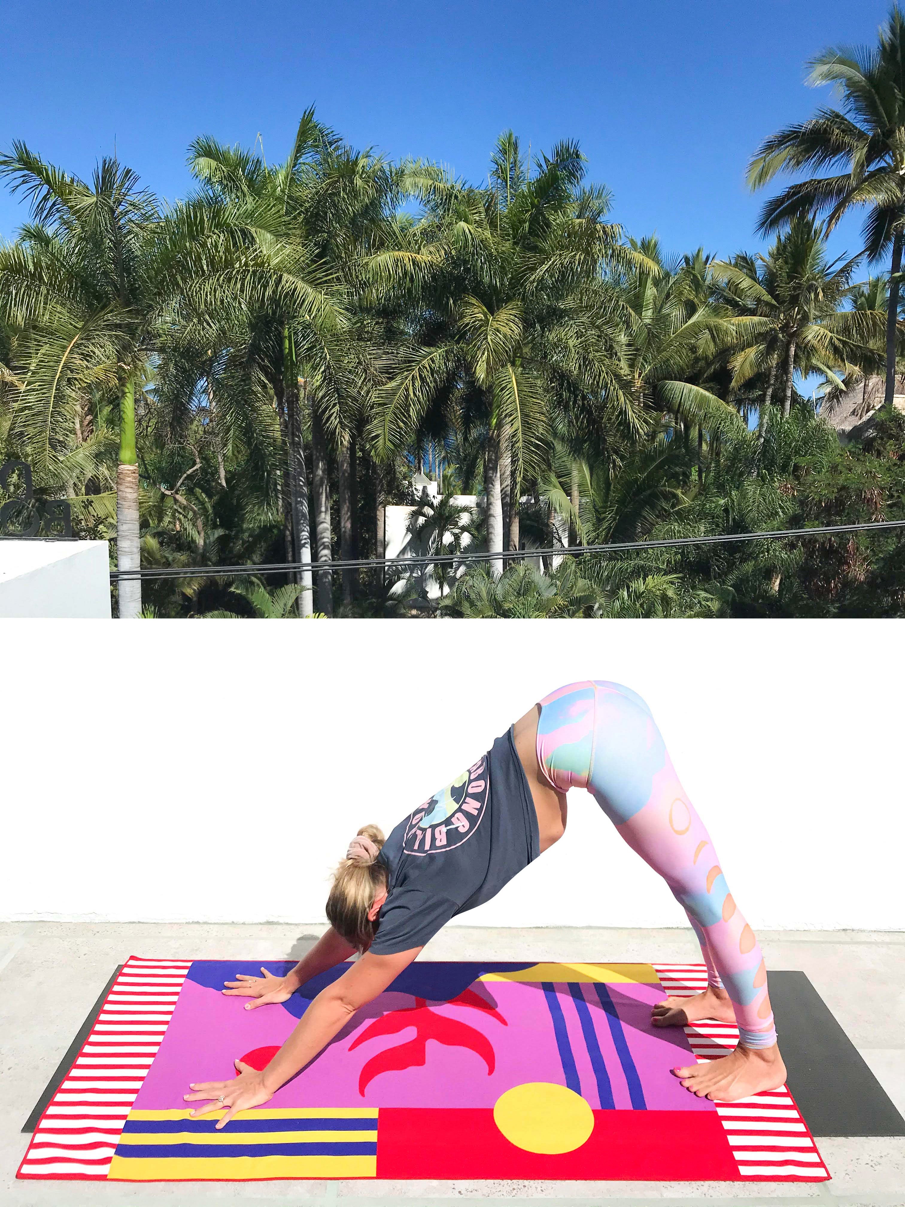 yoga teacher doing a yoga pose using a vibrant color yoga towel